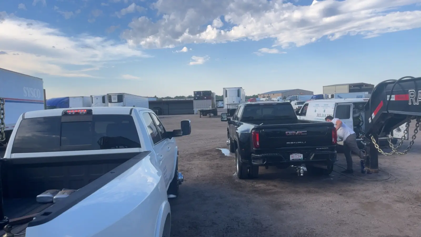 KP Storage Solutions pickup trucks and trailers parked in a lot